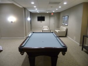 The pool table is in the community room.