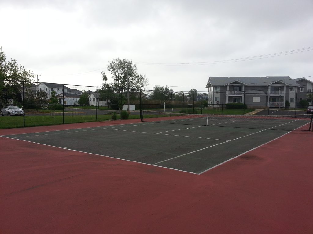 Sands Point South has a tennis court right by the pool.