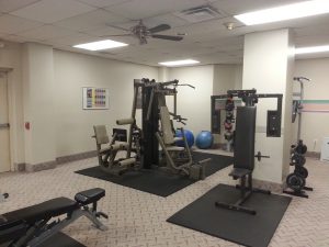 The fitness room has free weights and weight machines plus his/hers lockers and showers.